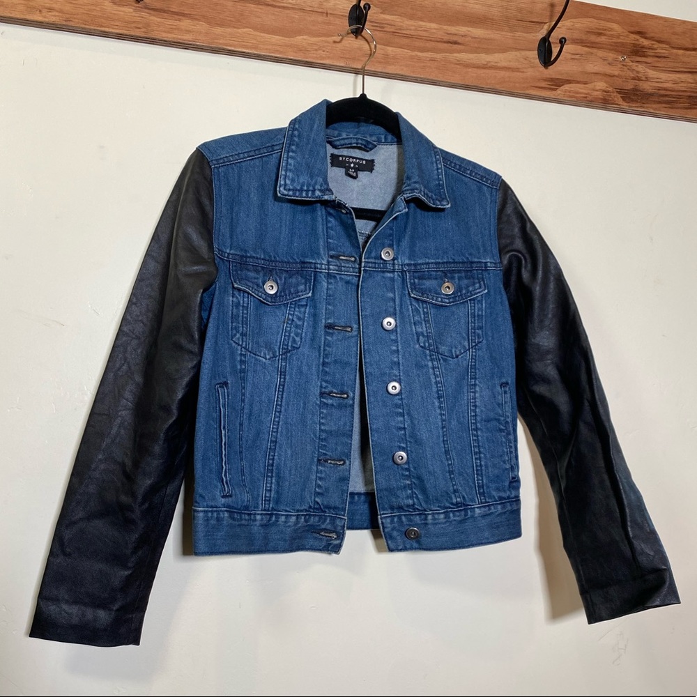 Denim jacket with leather sleeves